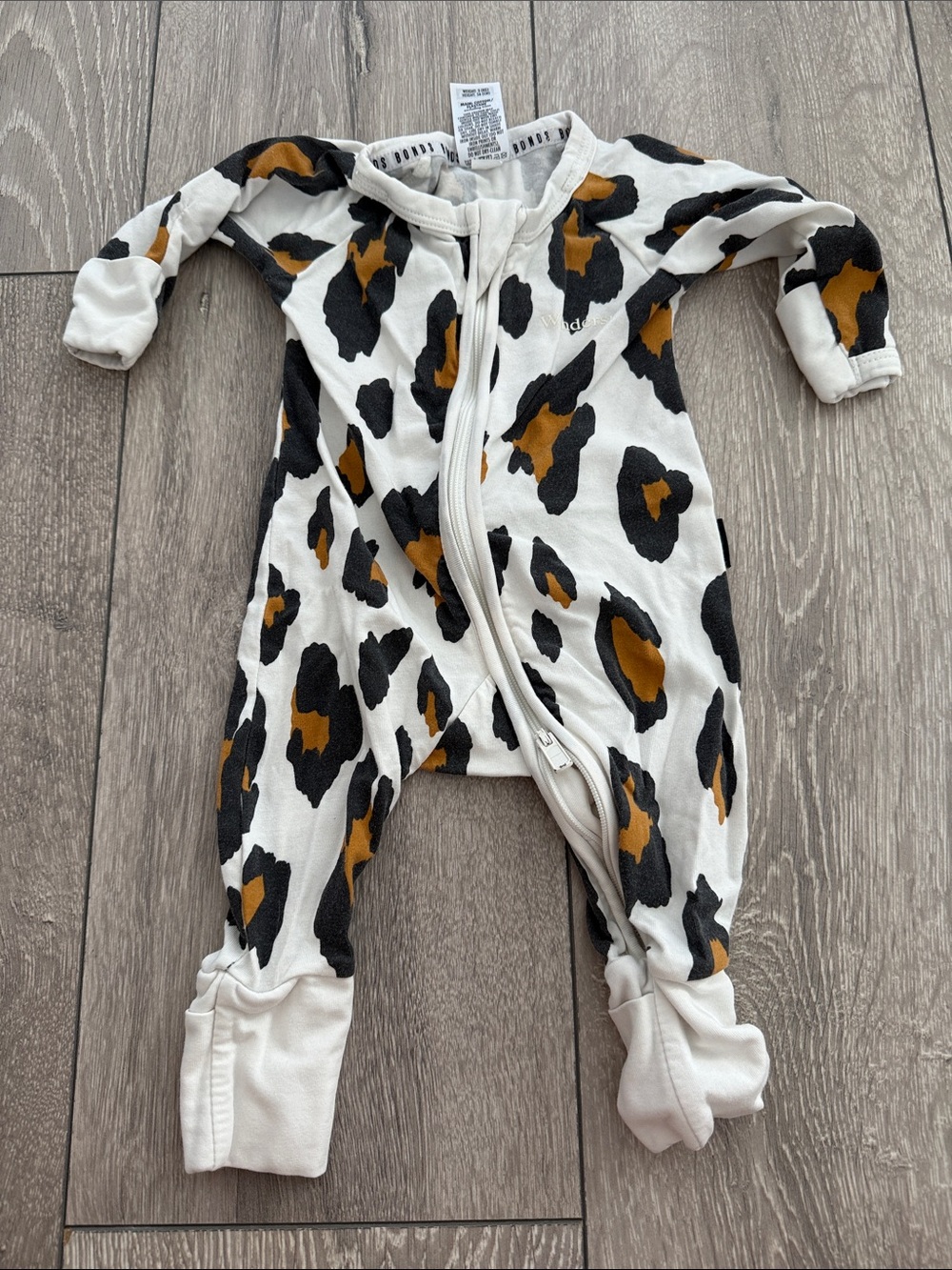 Bonds White Leopard Zip Front Baby One-Piece with Black and Mustard Spots